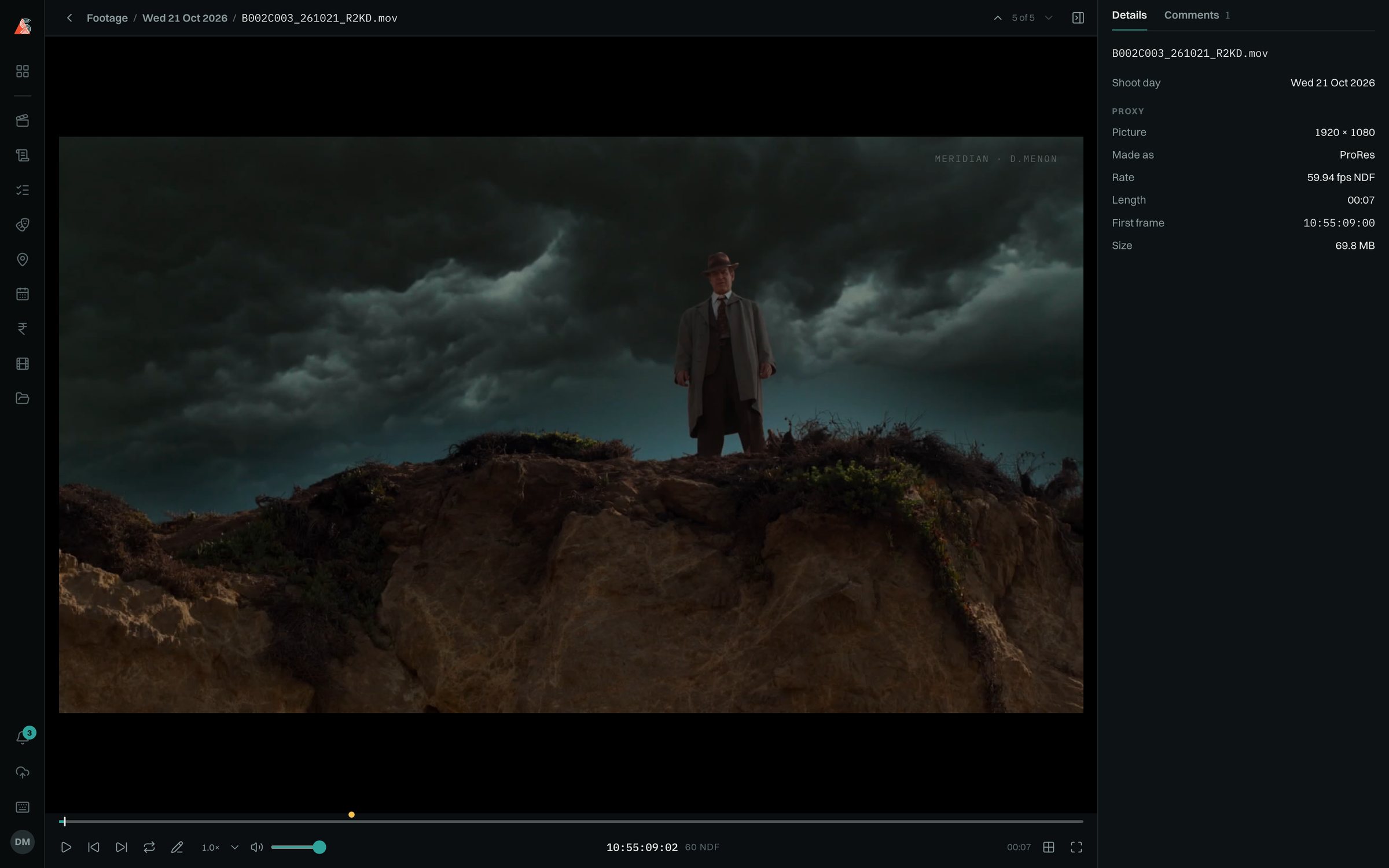 A daily of The Long Coast playing: a man in a hat on a cliff under a storm, the director's name faint over the picture, and the file's details beside it.